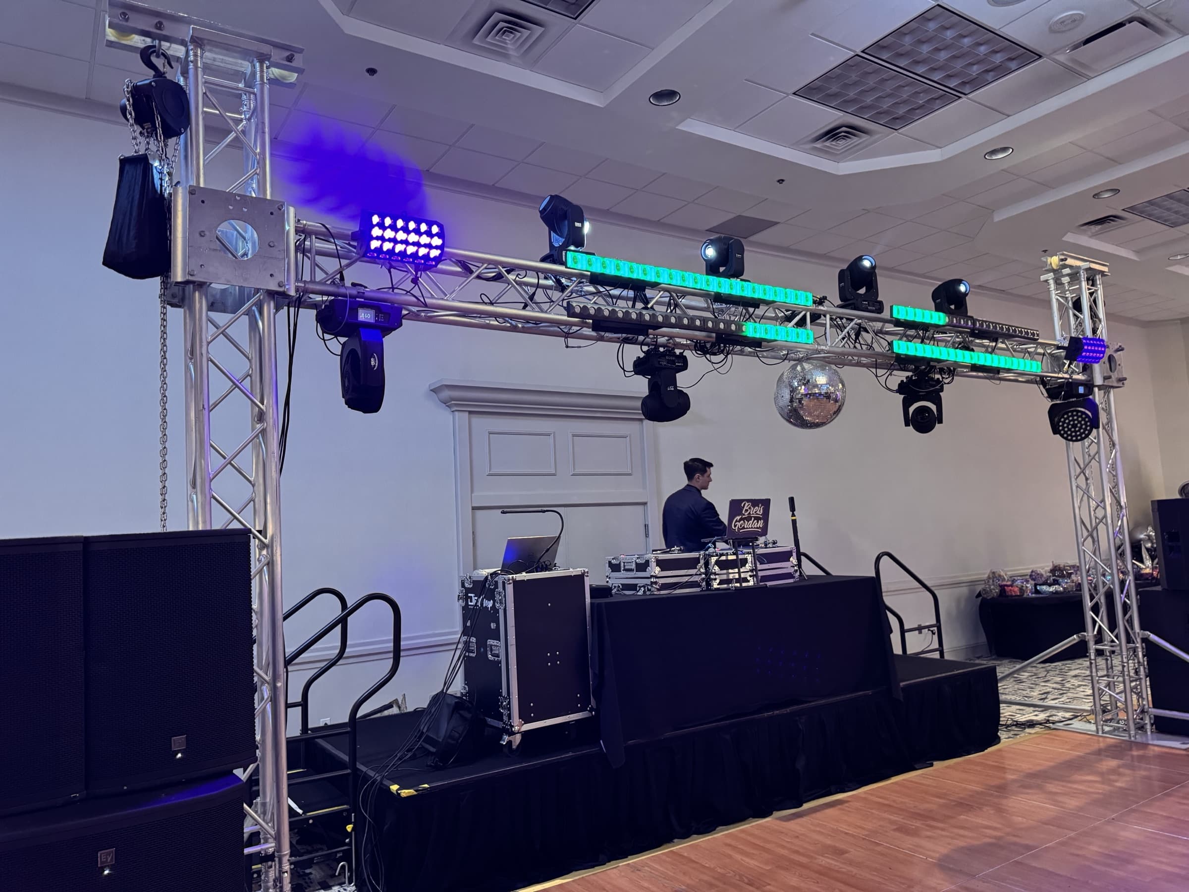 Platinum setup: the goalpost truss rig with moving heads, LED bars and mirror ball from the dance-floor side